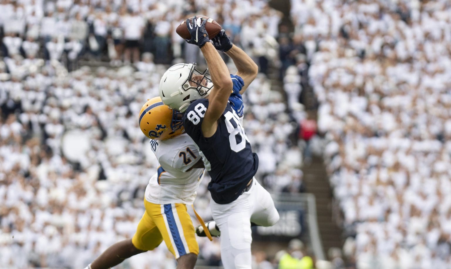 Penn State wide receiver Dan Chisena (88) attempts to haul in a pass as Pittsburgh defensive back Damarri Mathis (21) defends in the third quarter of an NCAA college football game in State College, Pa., on Saturday, Sept. 14, 2019. (AP Photo/Barry Reeger)