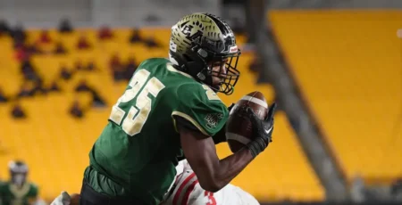 Penn State football commit Quinton Martin runs with the football for Belle Vernon.