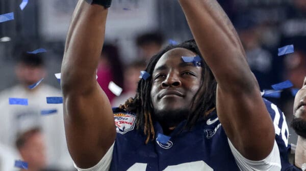 GLENDALE, AZ - DECEMBER 31: Penn State Nittany Lions tight end Khalil Dinkins holds the championship trophy after the CFP Quarterfinal Vrbo Fiesta Bowl featuring the Penn State Nittany Lions vs. the Boise State Broncos on December 31, 2024 at State Farm Stadium in Glendale, Arizona. (Photo by Steve Nurenberg/Icon Sportswire)