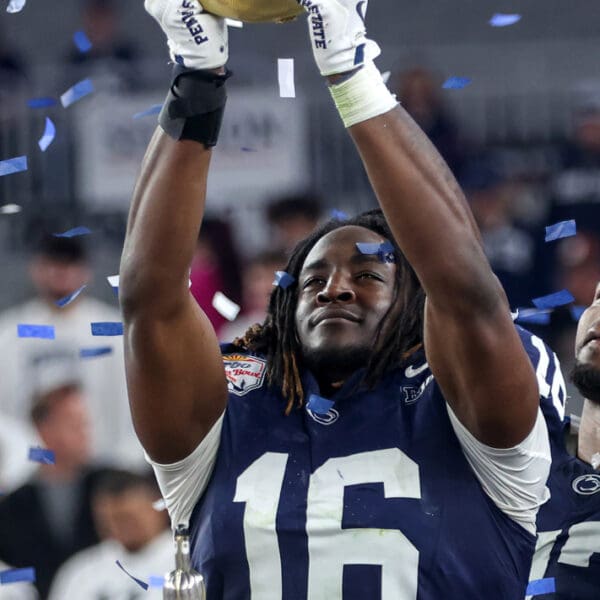 GLENDALE, AZ - DECEMBER 31: Penn State Nittany Lions tight end Khalil Dinkins holds the championship trophy after the CFP Quarterfinal Vrbo Fiesta Bowl featuring the Penn State Nittany Lions vs. the Boise State Broncos on December 31, 2024 at State Farm Stadium in Glendale, Arizona. (Photo by Steve Nurenberg/Icon Sportswire)