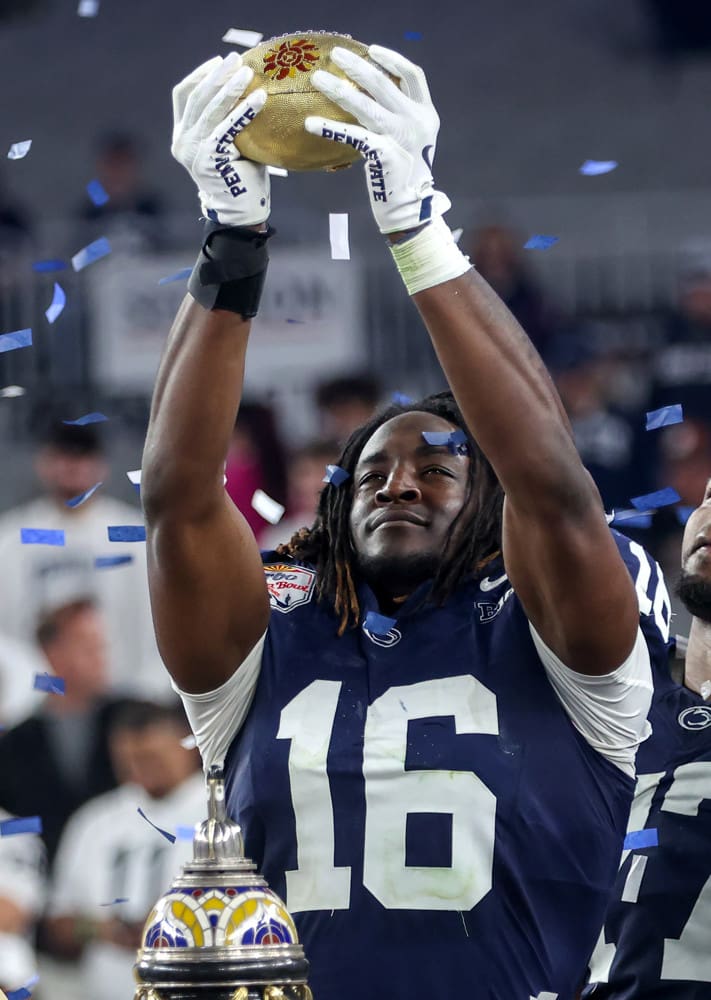 GLENDALE, AZ - DECEMBER 31: Penn State Nittany Lions tight end Khalil Dinkins holds the championship trophy after the CFP Quarterfinal Vrbo Fiesta Bowl featuring the Penn State Nittany Lions vs. the Boise State Broncos on December 31, 2024 at State Farm Stadium in Glendale, Arizona. (Photo by Steve Nurenberg/Icon Sportswire)